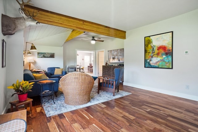 living room featuring beam ceiling, wood-type flooring, and ceiling fan