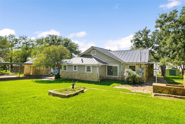 view of front facade with a front yard and a carport