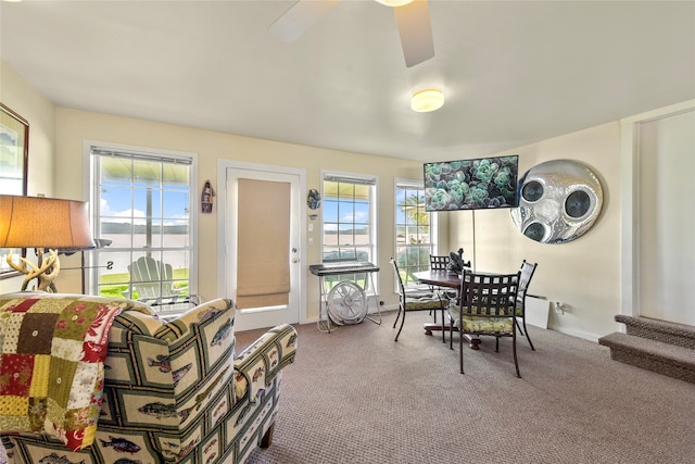 dining area with carpet and ceiling fan