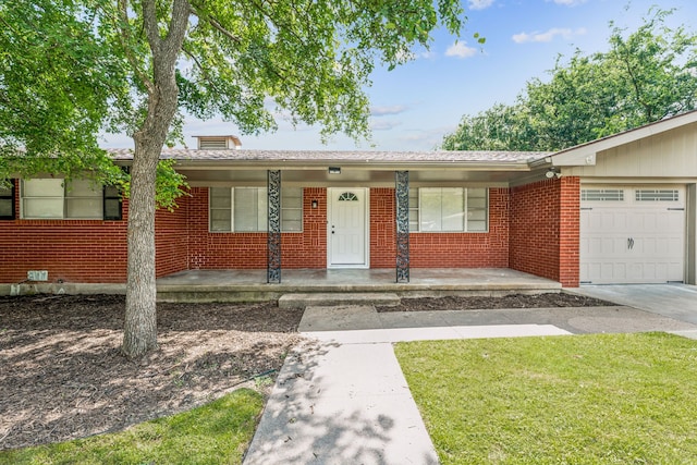 ranch-style house featuring a garage, a front lawn, and a porch