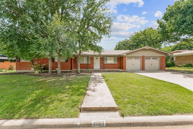 view of front of home featuring a garage and a front lawn