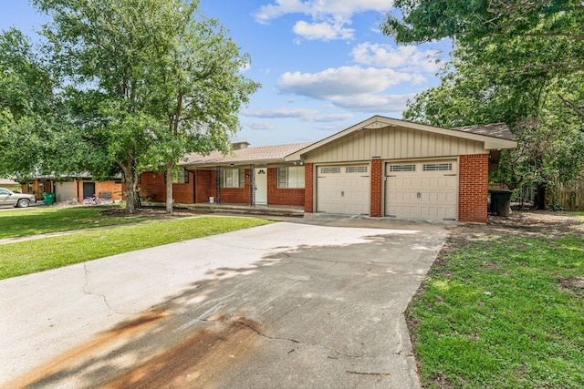 single story home with a garage and a front lawn