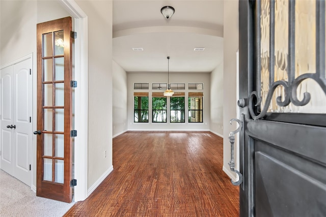 foyer featuring french doors and hardwood / wood-style floors