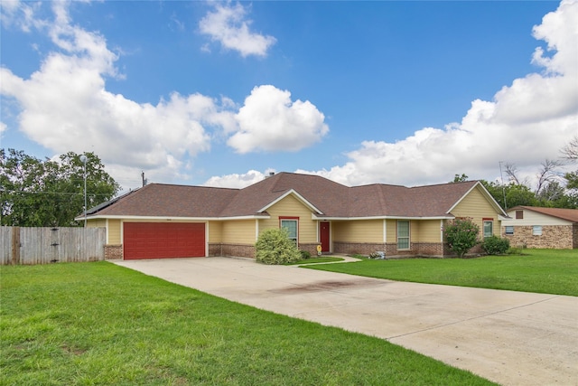 ranch-style house with a garage and a front yard