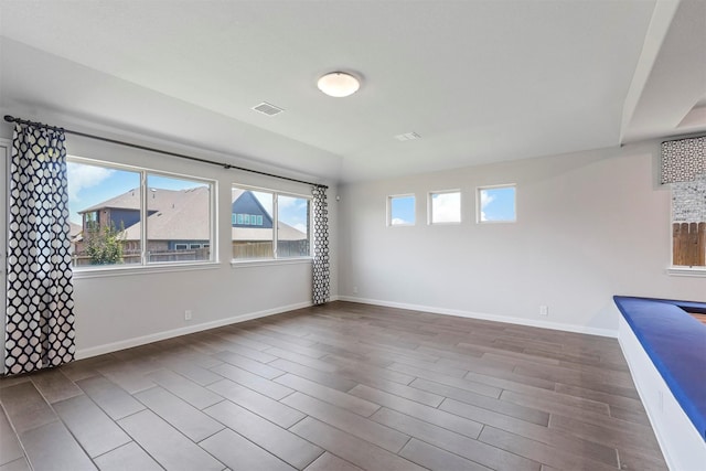 unfurnished room featuring hardwood / wood-style flooring