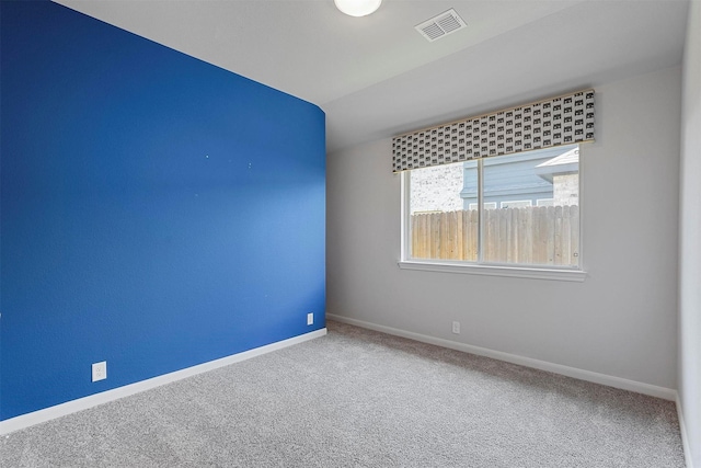 empty room with carpet flooring