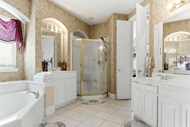 bathroom featuring tile patterned floors, vanity, and separate shower and tub