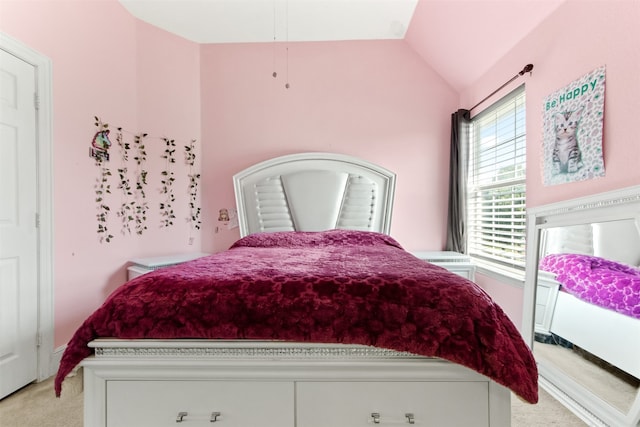 carpeted bedroom with vaulted ceiling