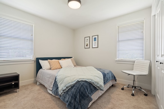 carpeted bedroom featuring a closet