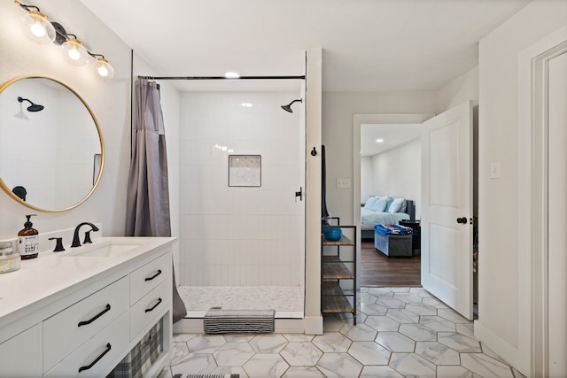 bathroom with wood-type flooring, vanity, and curtained shower