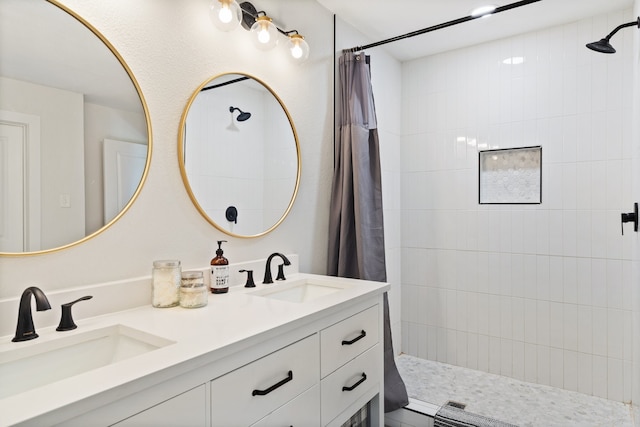 bathroom featuring vanity and curtained shower