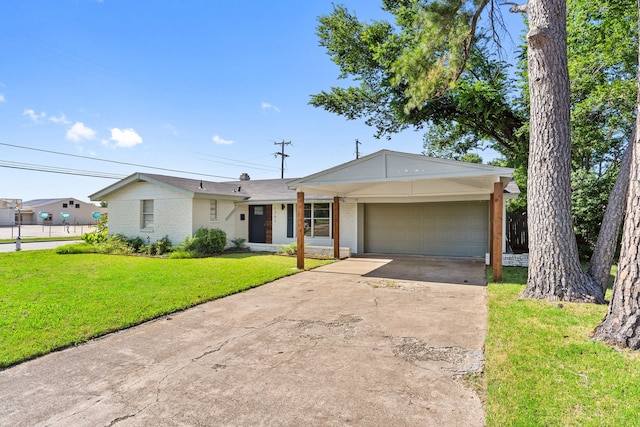 ranch-style home featuring a garage and a front lawn