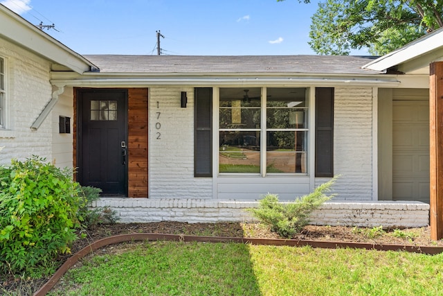 view of exterior entry featuring a garage