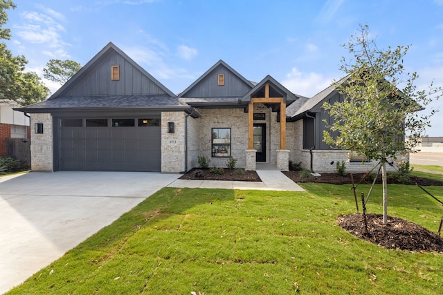 view of front of house with a front yard and a garage