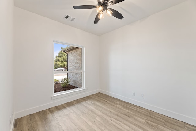 spare room featuring ceiling fan and light hardwood / wood-style flooring