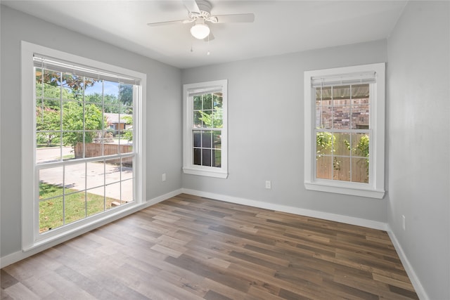 unfurnished room featuring ceiling fan and hardwood / wood-style floors