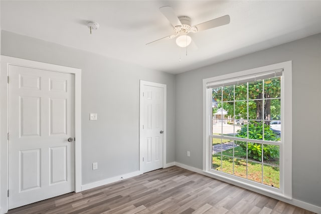 spare room featuring ceiling fan and light wood-type flooring