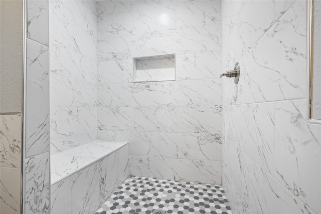 bathroom featuring tiled shower