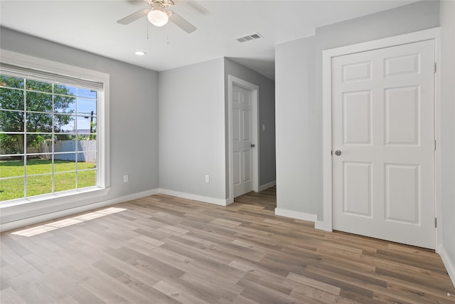 unfurnished room featuring hardwood / wood-style flooring and ceiling fan