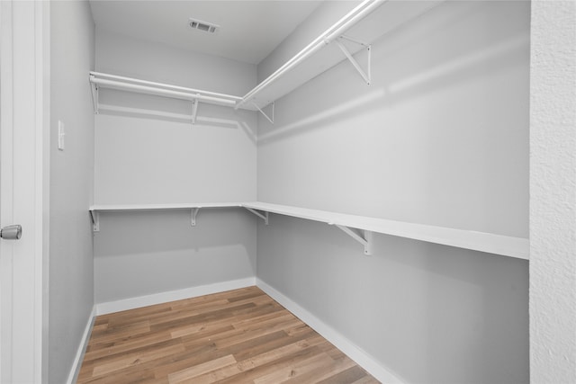 spacious closet with wood-type flooring