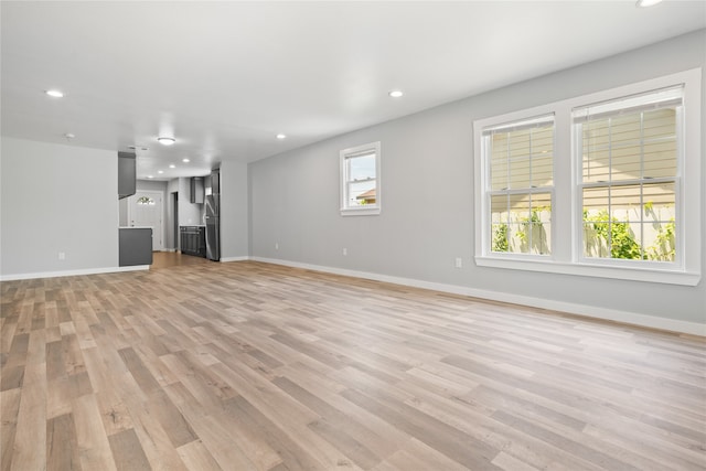 unfurnished living room with light wood-type flooring