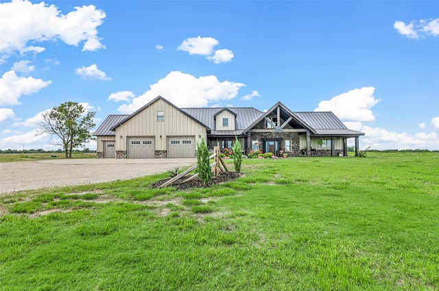 view of front of property featuring a garage and a front lawn