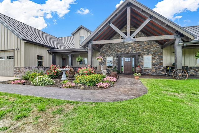 view of front of property with a front yard and a garage