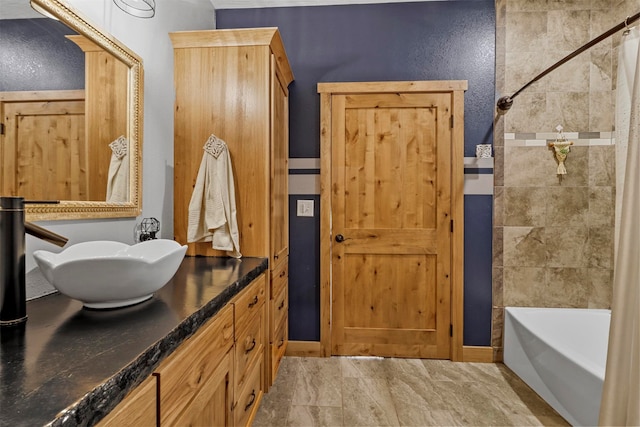 bathroom featuring tile flooring, vanity, and shower / bath combo