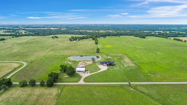 aerial view with a rural view and a water view