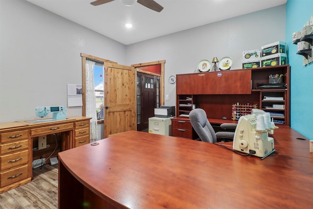 office area with hardwood / wood-style flooring and ceiling fan