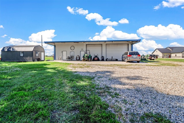 exterior space with a garage and a lawn