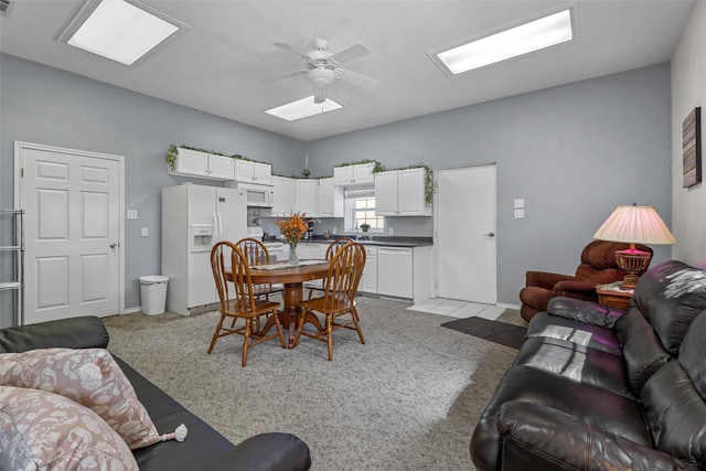 carpeted living room featuring ceiling fan