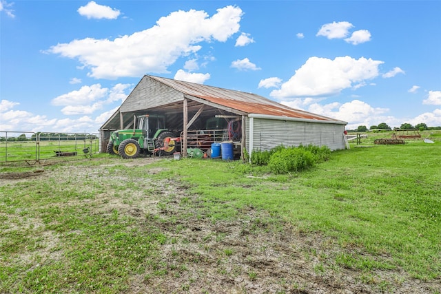 exterior space featuring a rural view and an outdoor structure