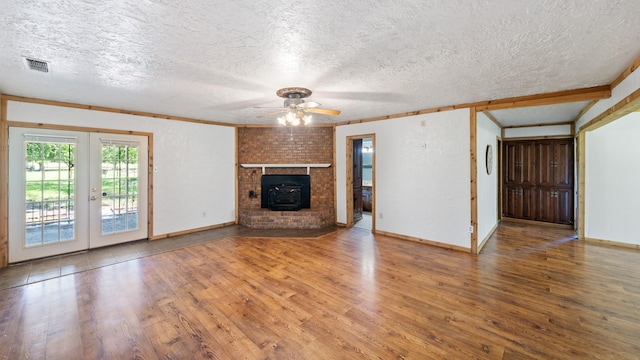 unfurnished living room with french doors, a textured ceiling, ceiling fan, and wood-type flooring