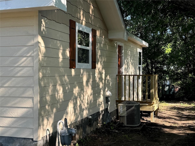 view of side of home featuring central AC