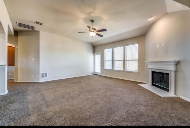 unfurnished living room featuring ceiling fan, carpet, and vaulted ceiling