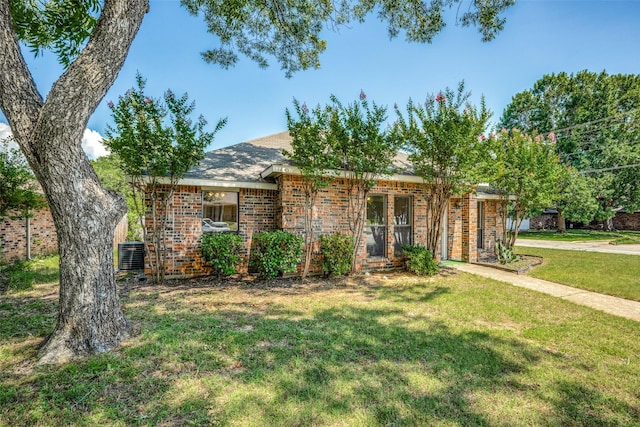 single story home with central AC and a front lawn