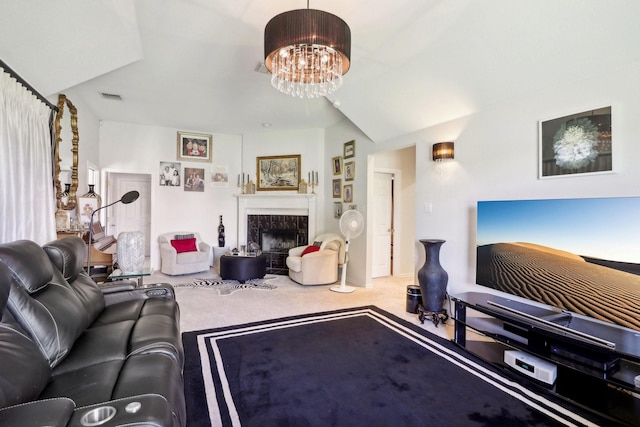 carpeted living area with a chandelier, visible vents, and a fireplace