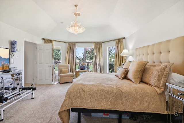 carpeted bedroom featuring a notable chandelier and lofted ceiling