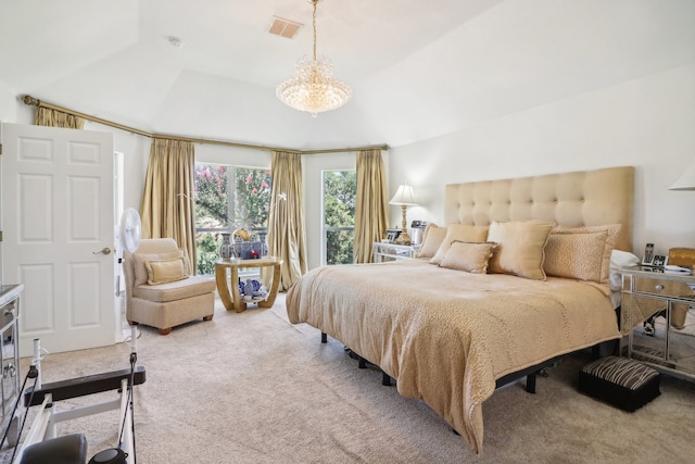 bedroom featuring a raised ceiling, an inviting chandelier, and light colored carpet