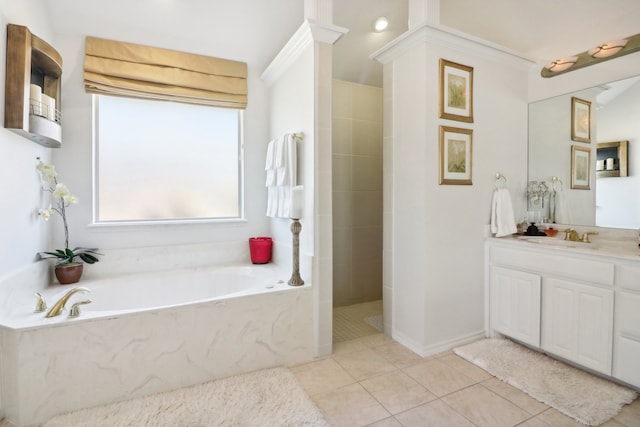 bathroom with tile patterned flooring, plus walk in shower, and vanity