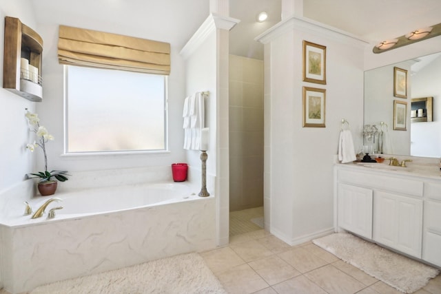 bathroom featuring a garden tub, tile patterned flooring, walk in shower, and vanity