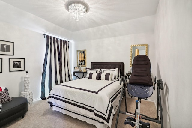 bedroom with a chandelier and carpet floors