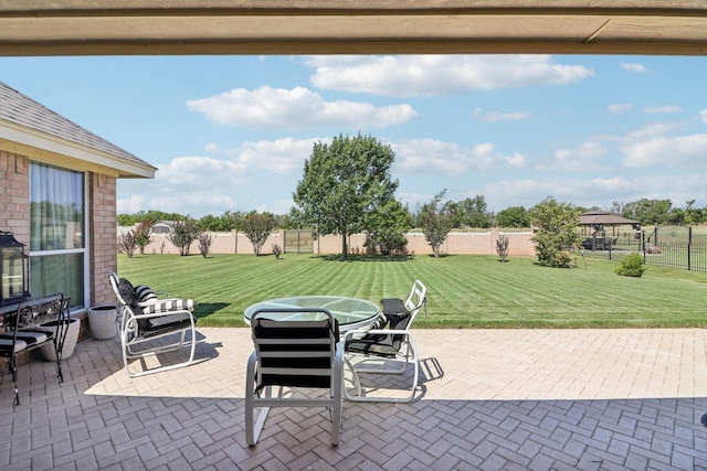 view of patio with fence and outdoor dining area