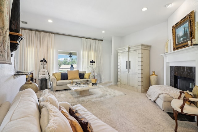 living room with a fireplace and carpet flooring