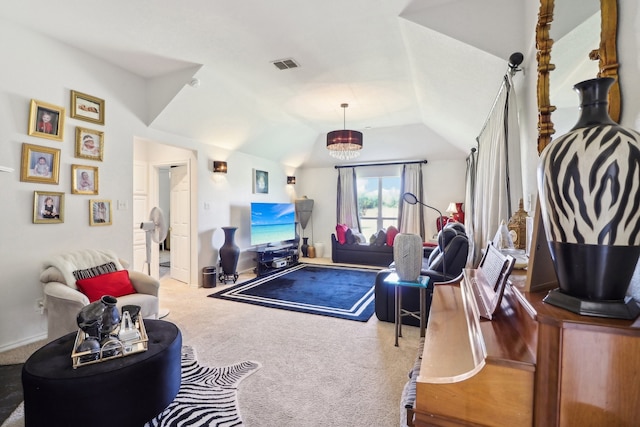 carpeted living room with vaulted ceiling