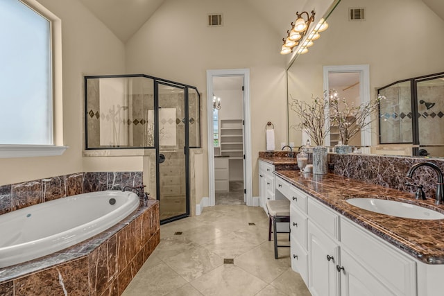 bathroom with high vaulted ceiling, vanity, and plus walk in shower