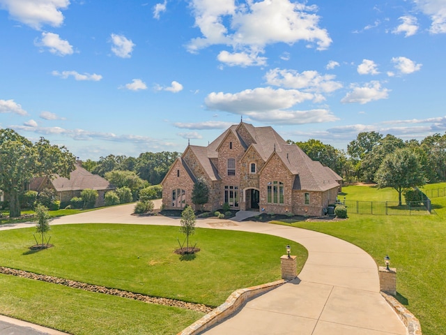 view of front of home with a front lawn