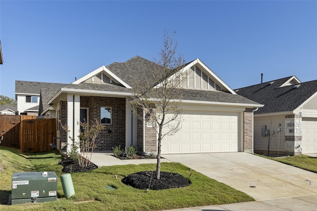 view of front of house with a front yard and a garage