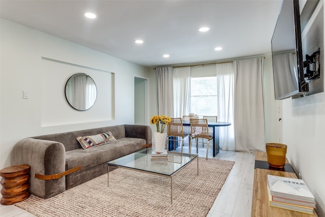 living room with light hardwood / wood-style flooring